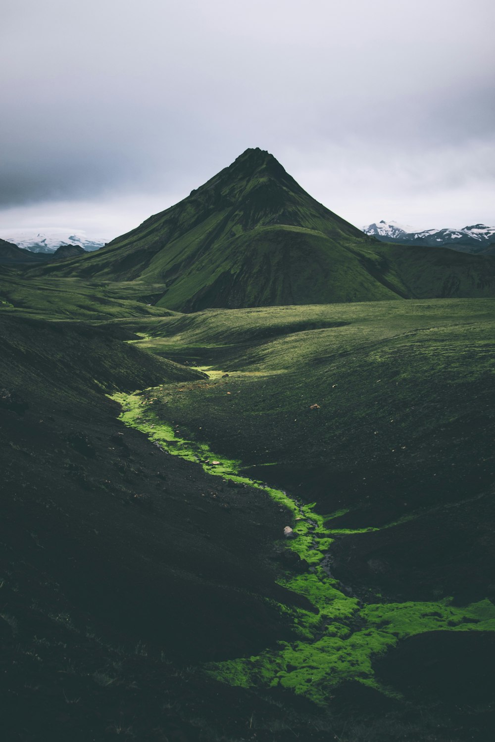 green mountain under white clouds during daytime