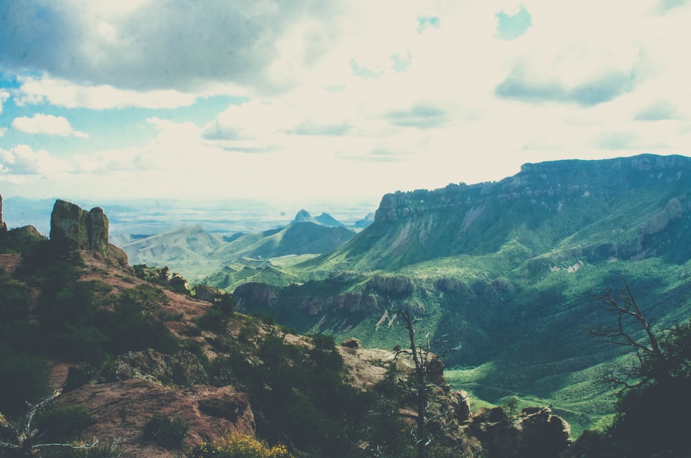 green and brown mountains under white clouds during daytime