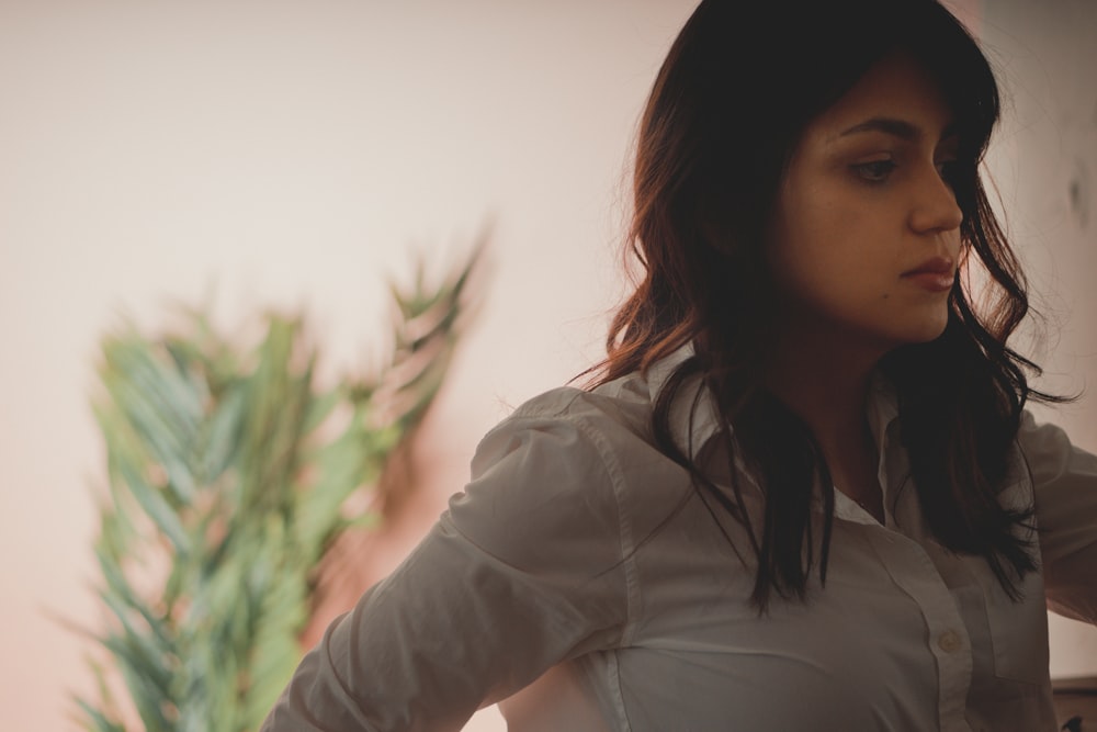 woman in white long sleeve shirt