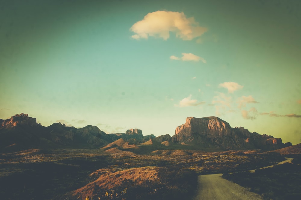 brown rocky mountain under blue sky