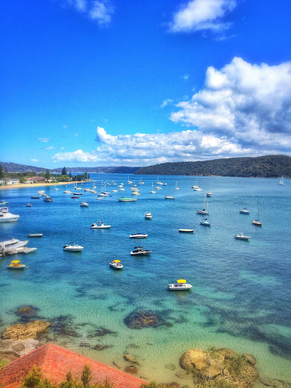 boats on sea under blue sky during daytime