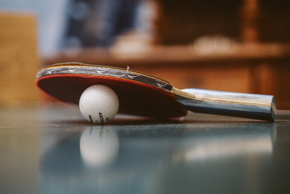 white golf ball on blue table