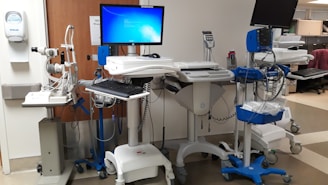 black flat screen tv turned on on white table