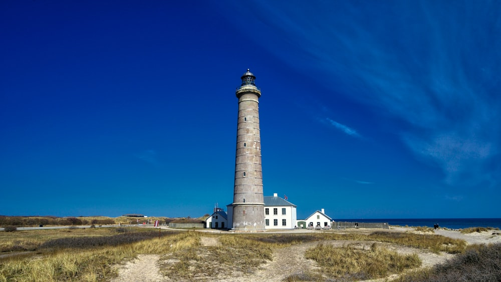 white and brown lighthouse under blue sky during daytime