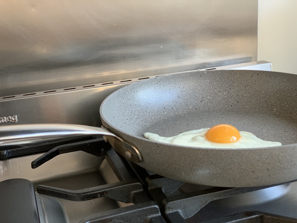 egg on black frying pan