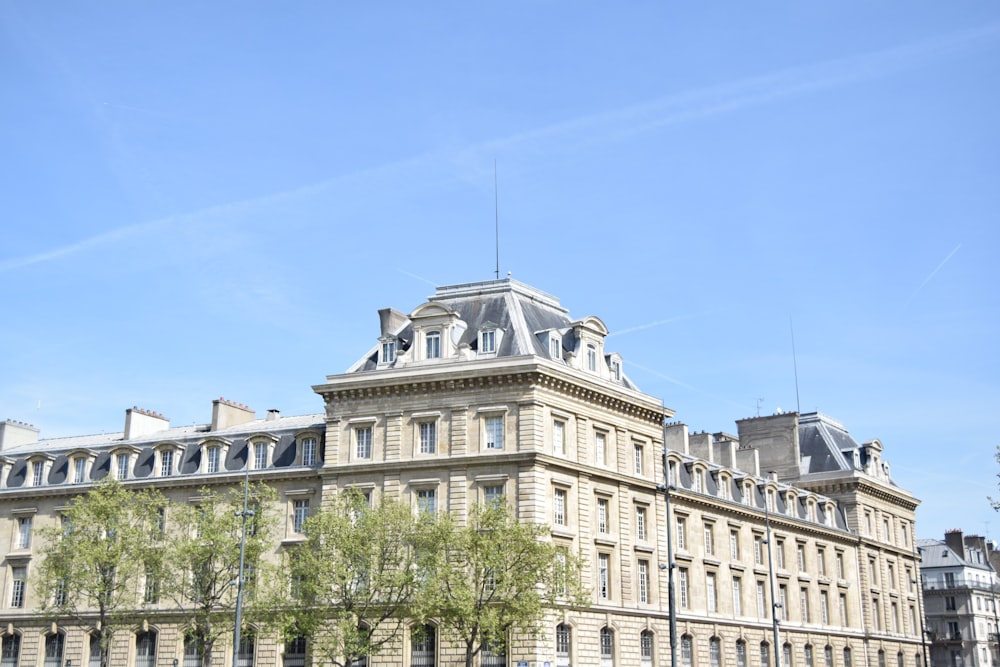 beige concrete building under blue sky during daytime