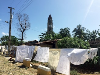 A serene outdoor scene with linen garments hanging to dry.