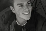 Happy young man expressing gratitude after successful treatment.