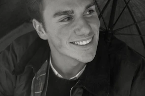 Happy young man expressing gratitude after successful treatment.