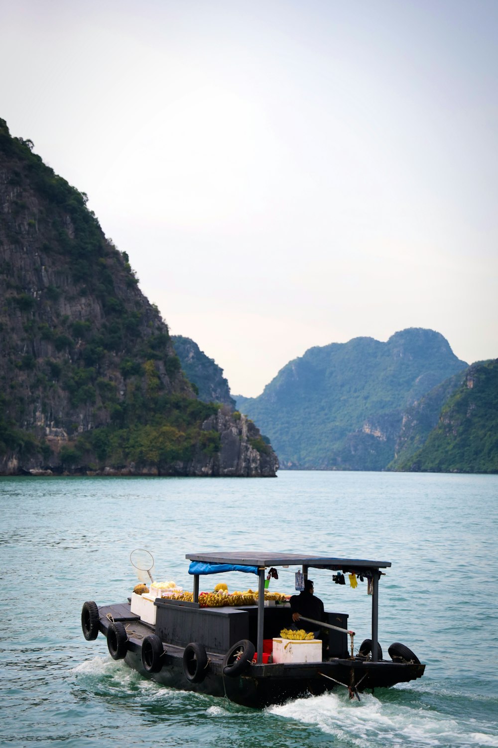 people sitting on bench on dock during daytime