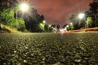 Nighttime shot of a Lumina Apparel windbreaker catching the glow of streetlights during an evening stroll.