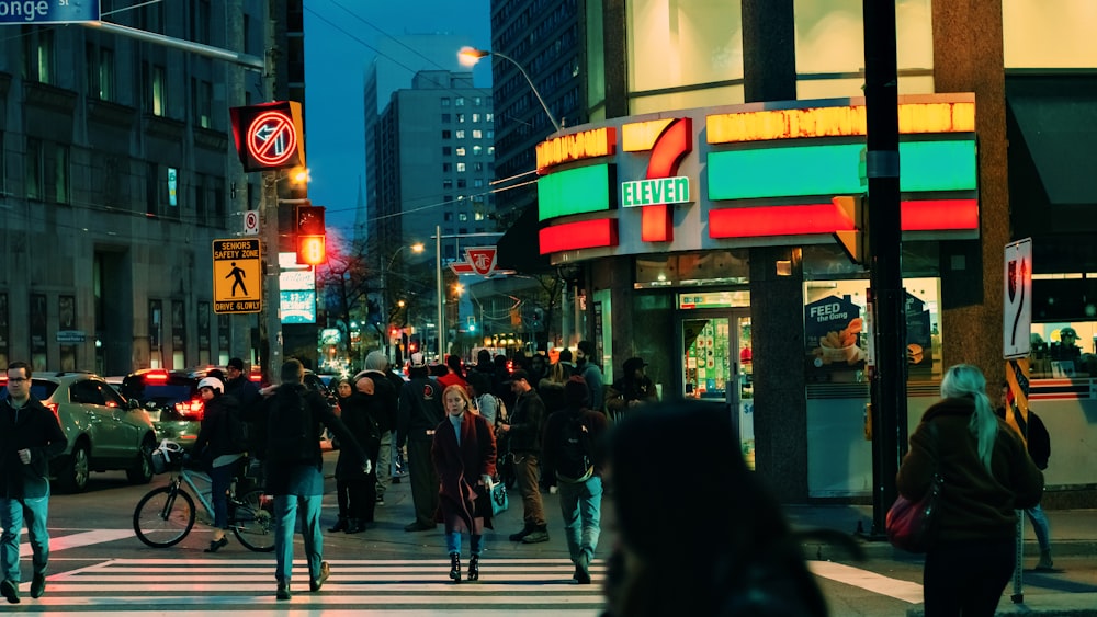 people walking on street during night time