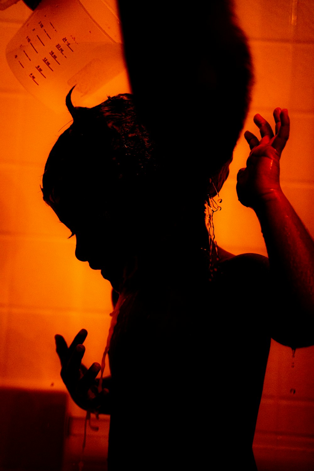 silhouette of woman in bathtub