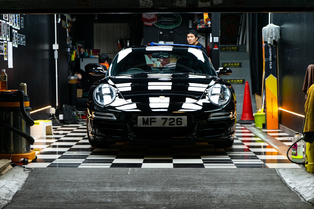 black porsche 911 parked on street during daytime