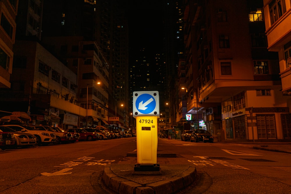 white and blue street sign