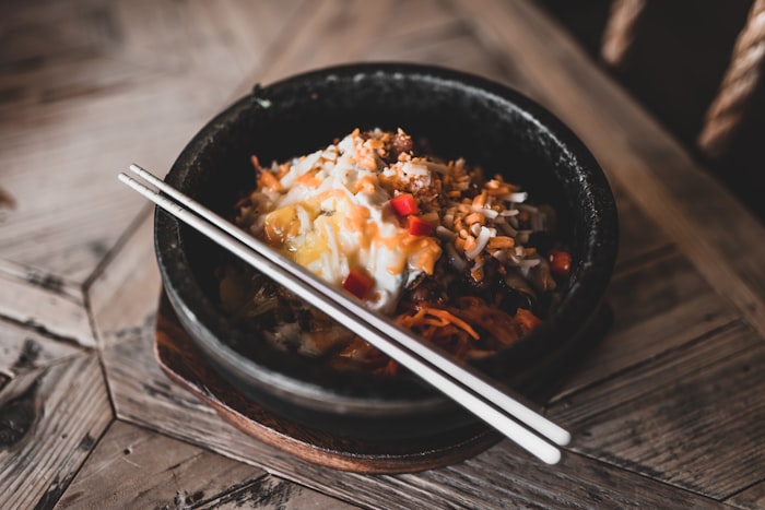 Japanese ramen shop with steam rising and traditional lanterns