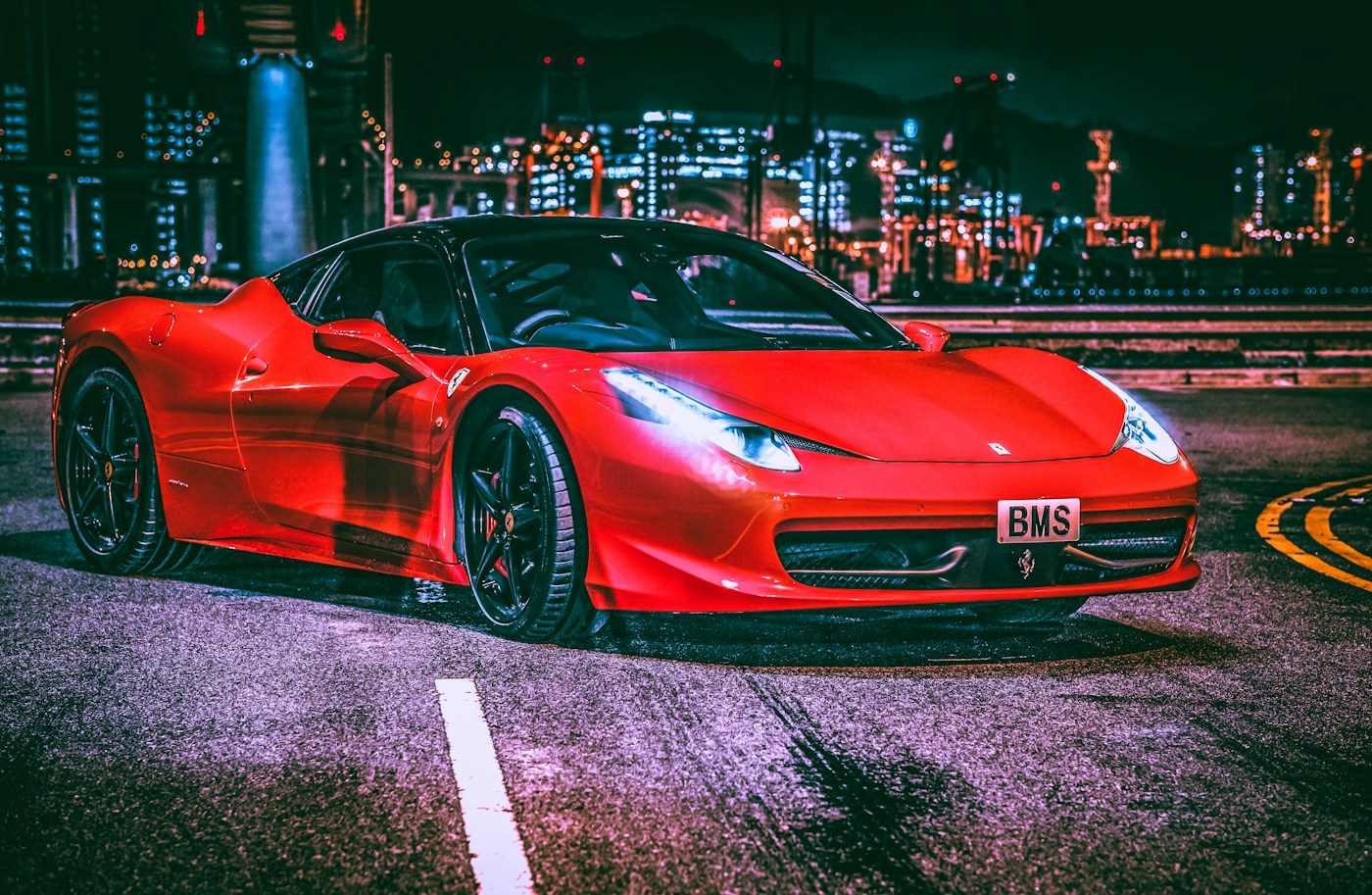 Red sports car wheel and fender after a full detail