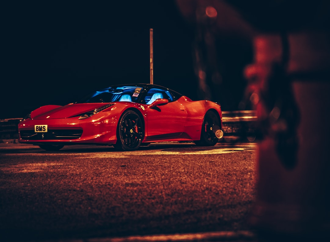  red ferrari 458 italia on road during night time pot container utensils