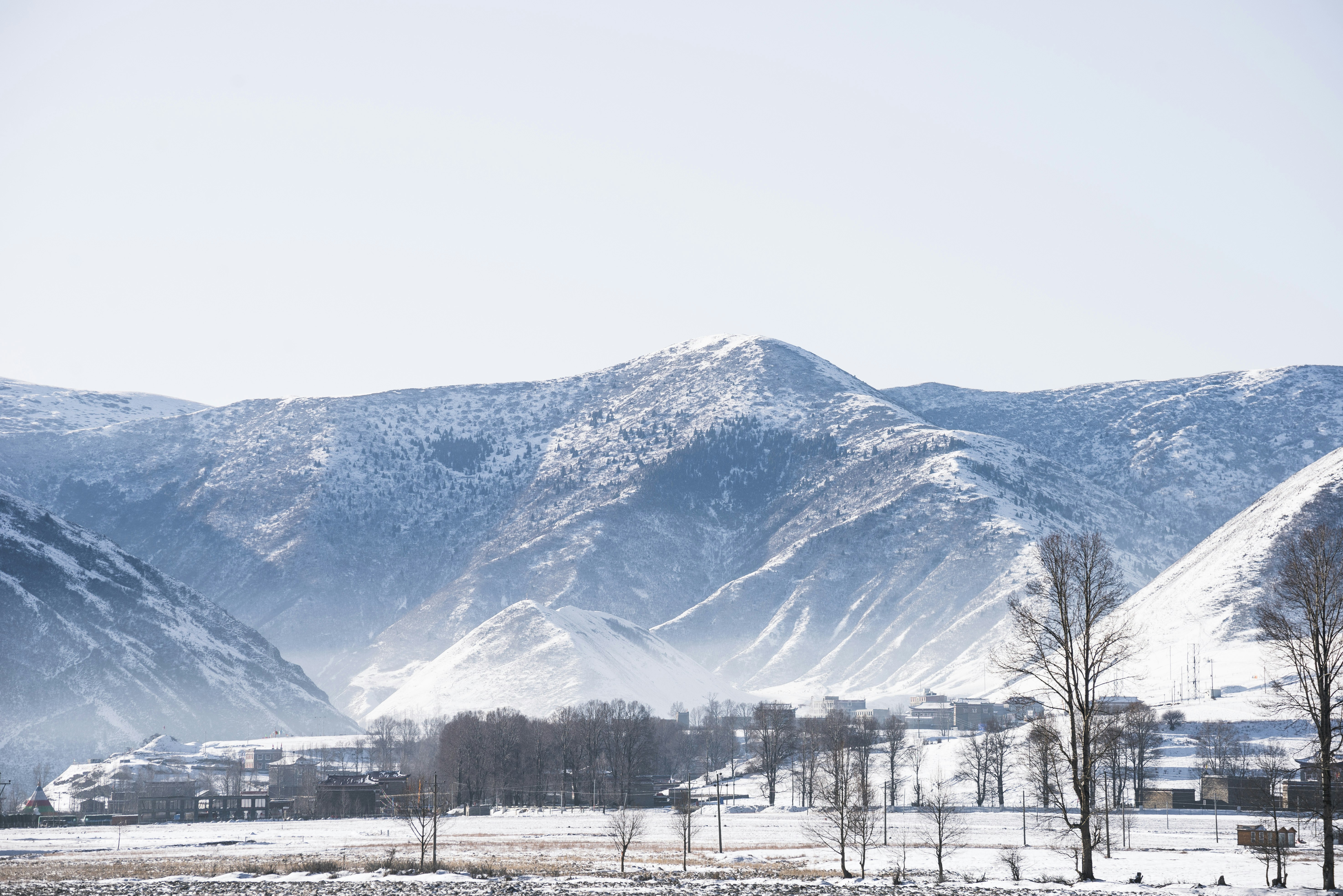 snow covered mountain under blue sky during daytime