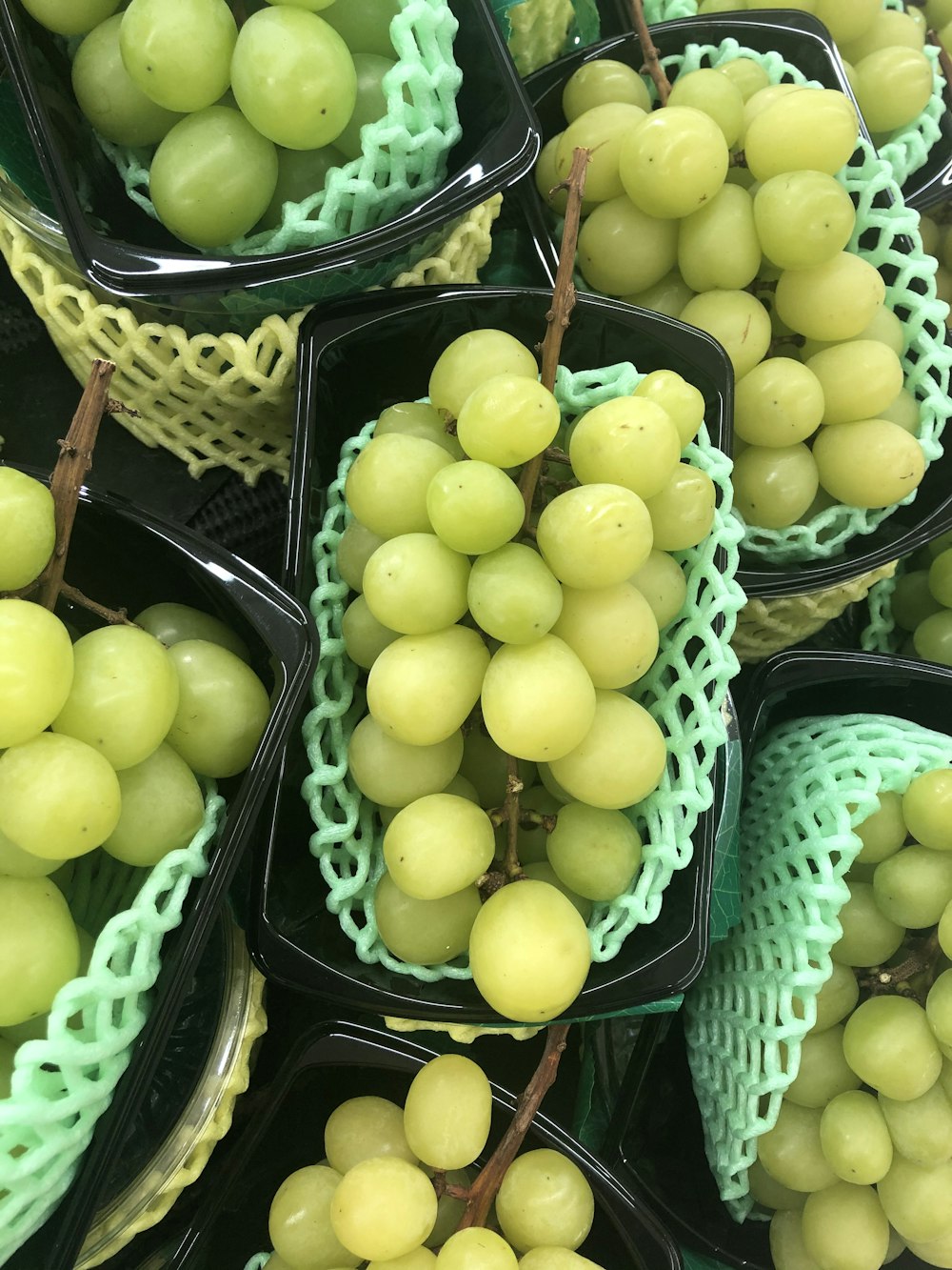 green apples on black plastic basket