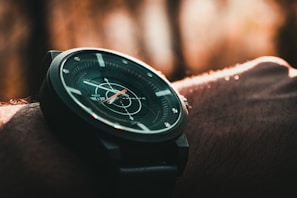 Close-up of a classic wristwatch with a leather strap displayed in a cozy watch store.