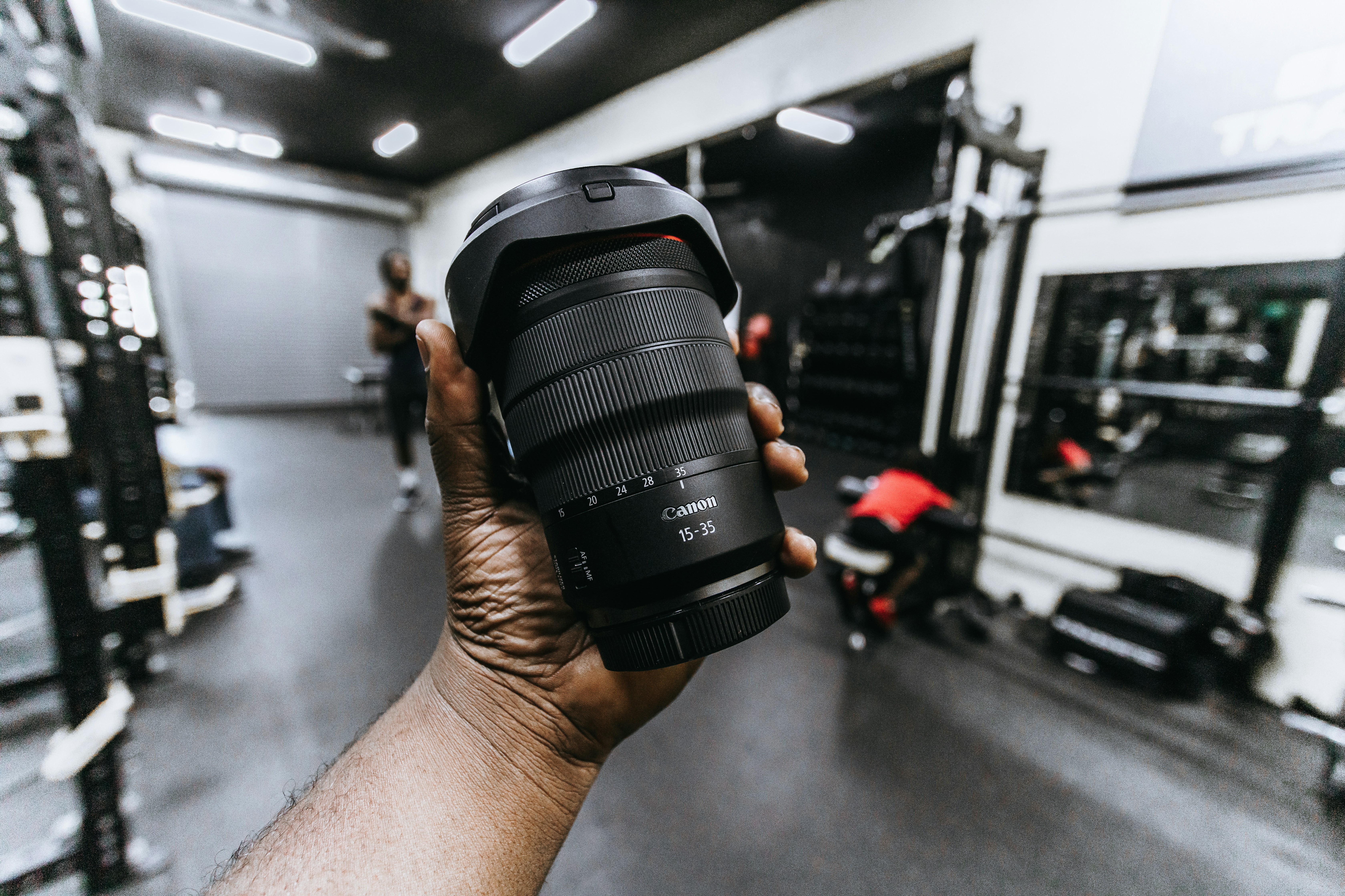 person holding black dslr camera