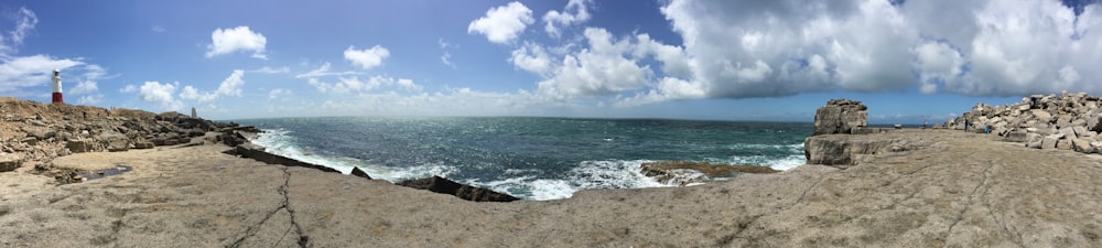 blue sea under blue sky and white clouds during daytime