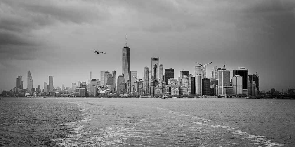 grayscale photo of city skyline during daytime