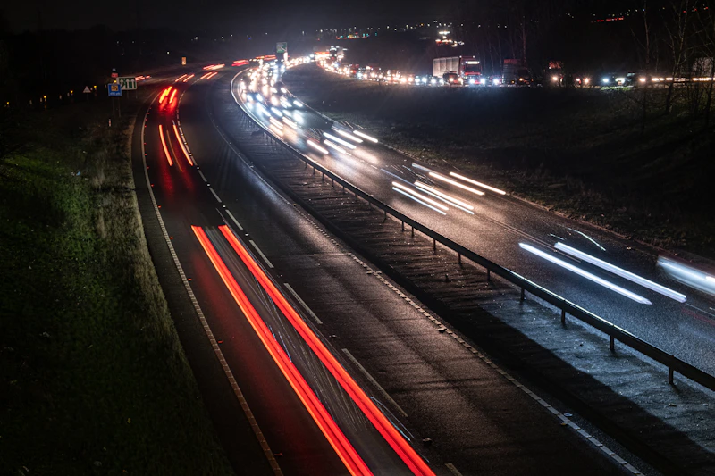 Cars driving on a UK motorway at night