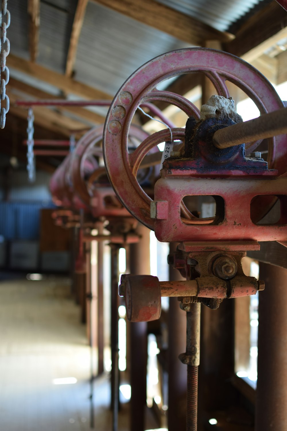 red metal machine in close up photography