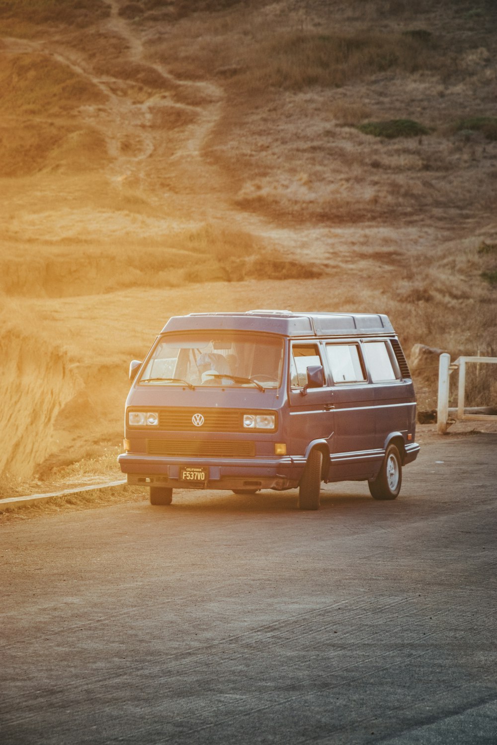 red and white volkswagen t-2 on road during daytime