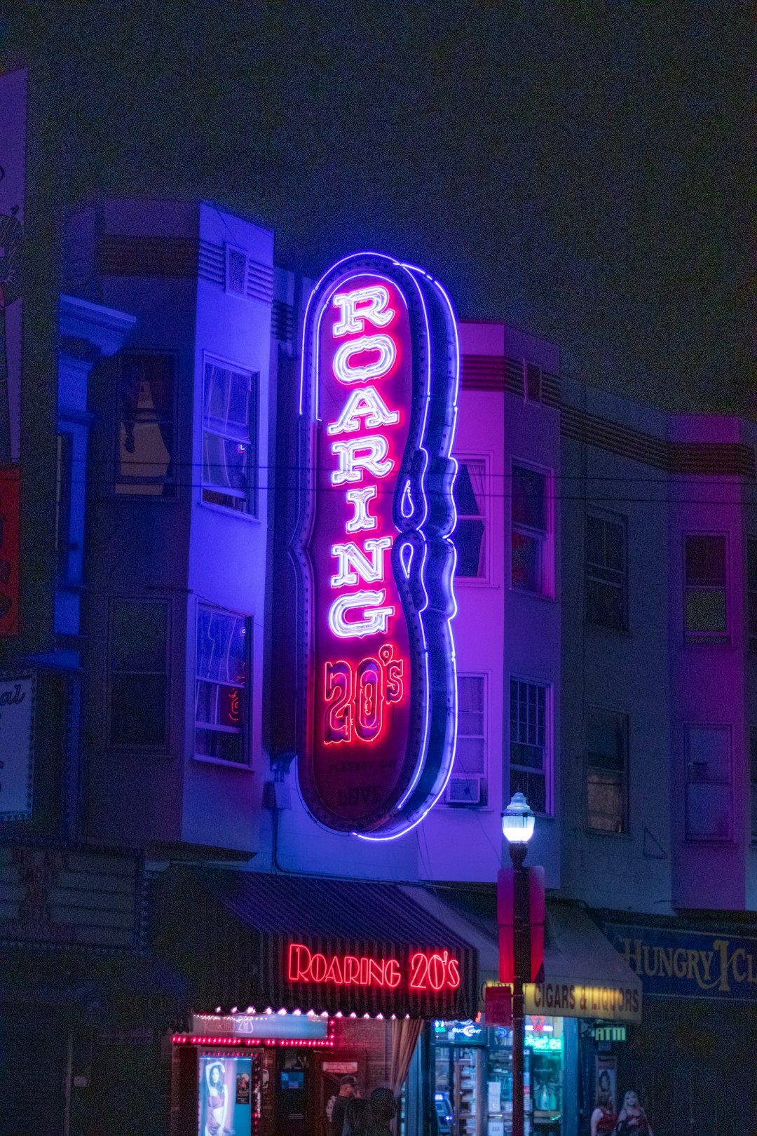 red and purple UNK neon light signage