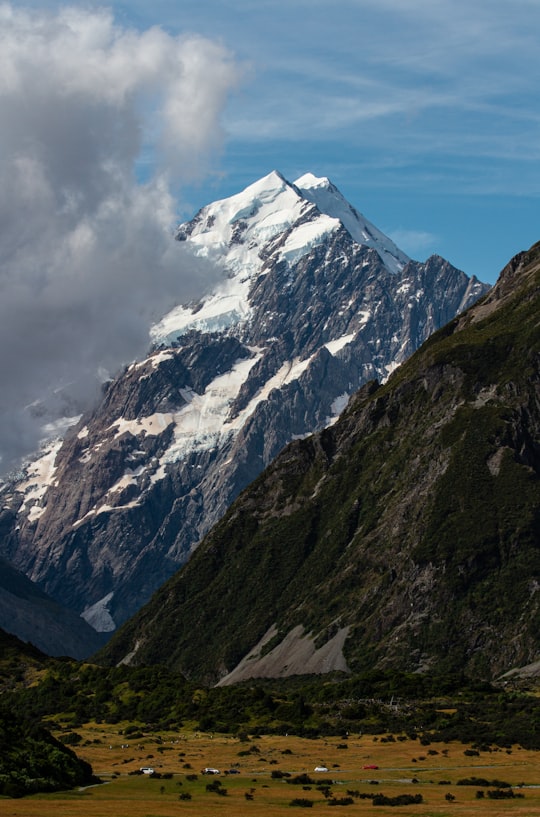 snow covered mountain under cloudy sky during daytime in Aoraki/Mount Cook New Zealand