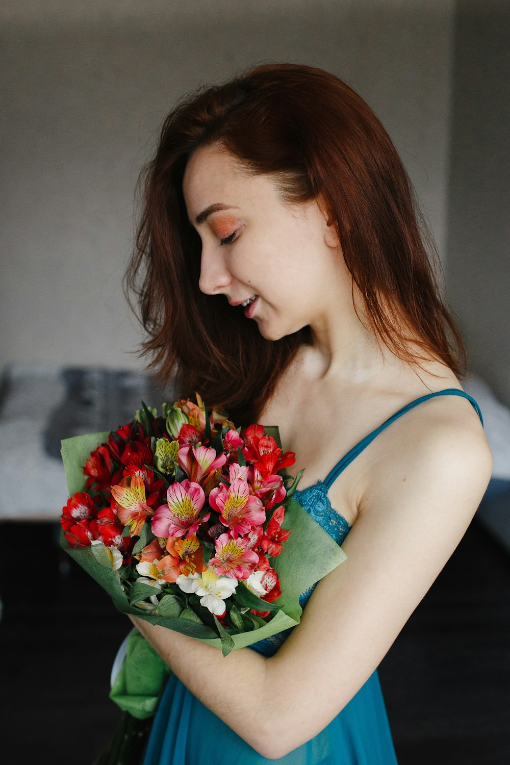 woman holding bouquet of flowers