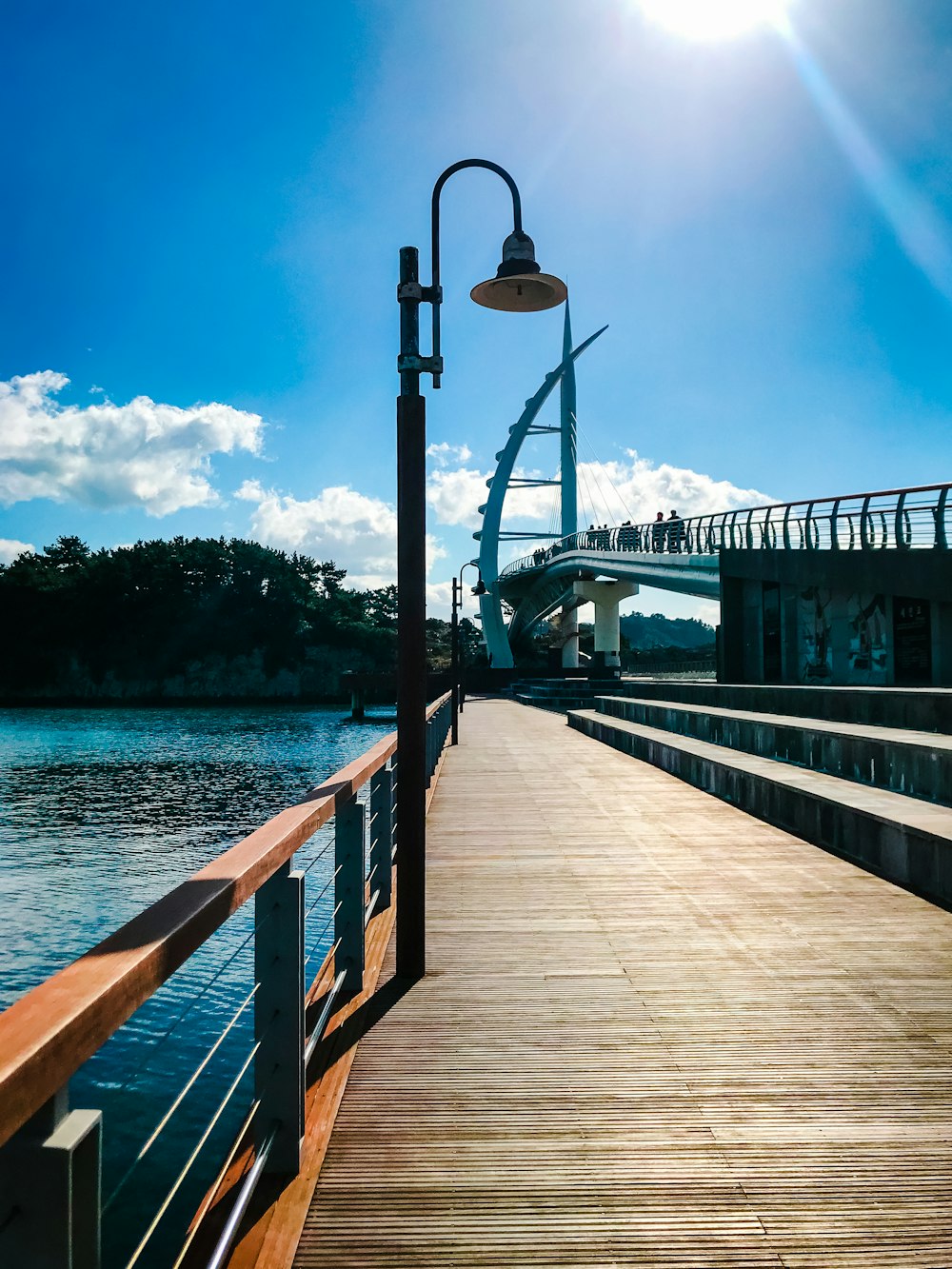 brown wooden dock on body of water during daytime