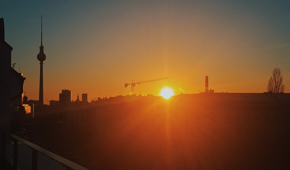 silhouette of city buildings during sunset