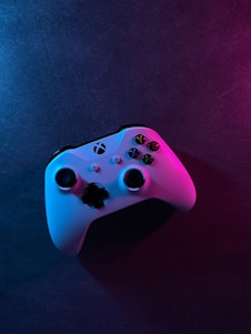 White xbox one game controller under gradient lighting.