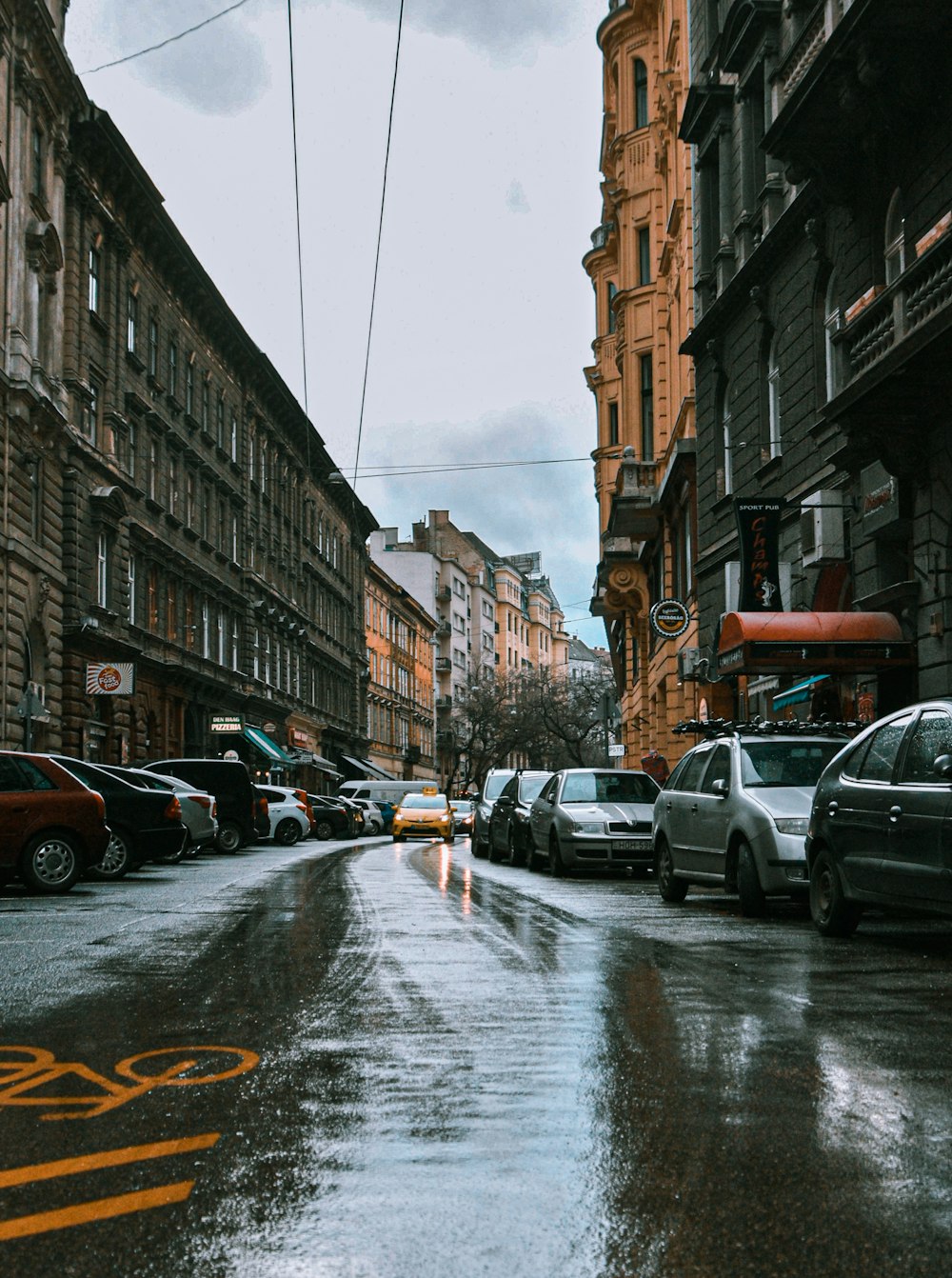 cars parked on side of the road during daytime