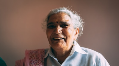 smiling woman in white button up shirt