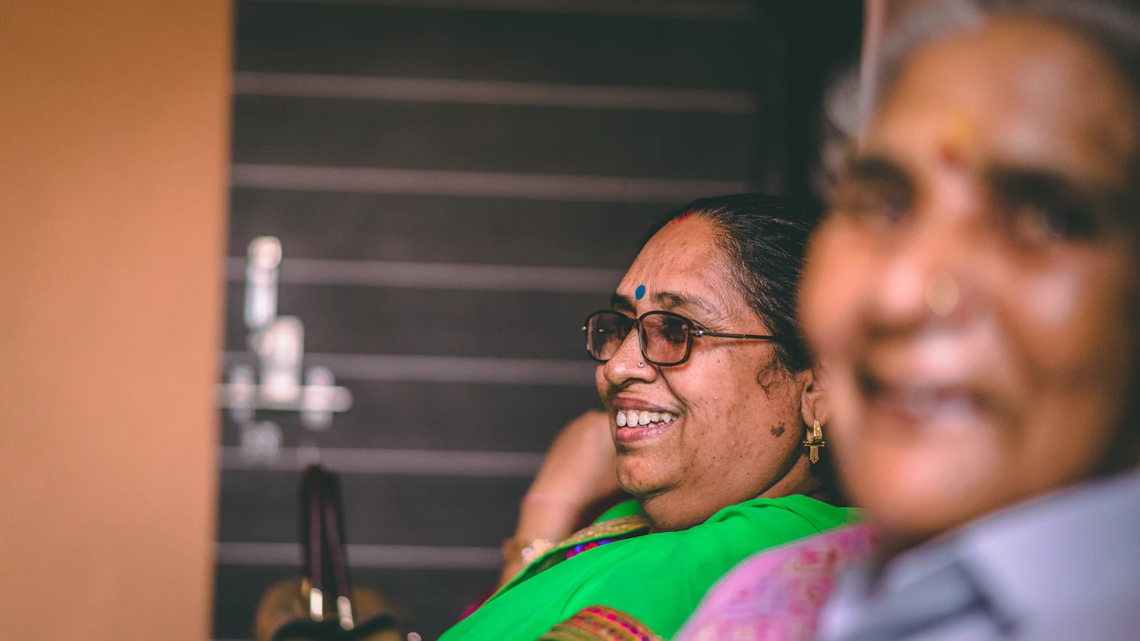 Elderly women laughing, sharing stories