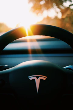 A happy winner holding Tesla car keys with a big smile.