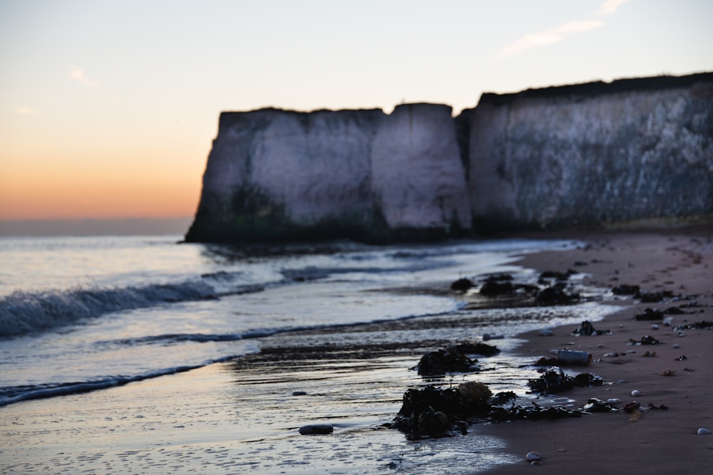 rock formation on sea shore during daytime