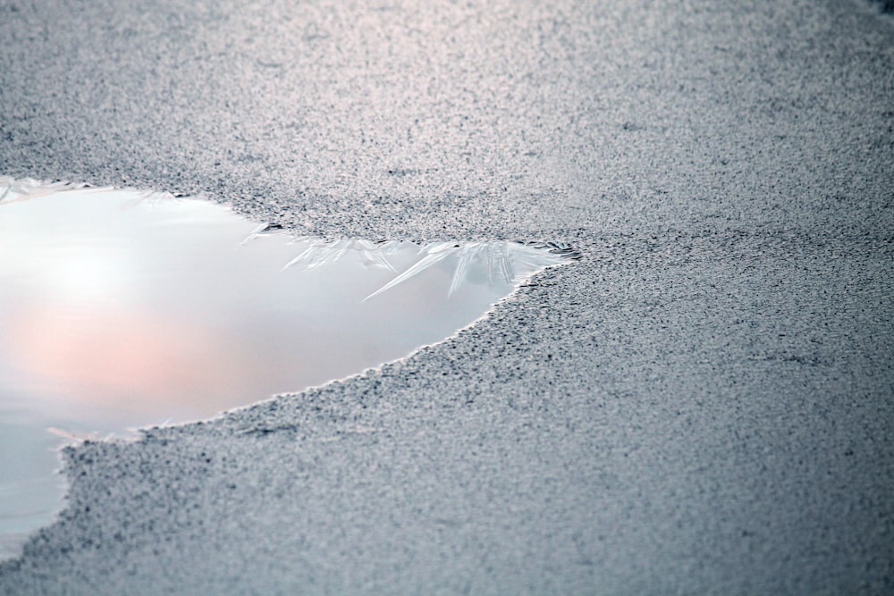 water wave on gray sand during daytime