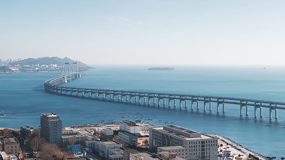 aerial view of city buildings near sea during daytime