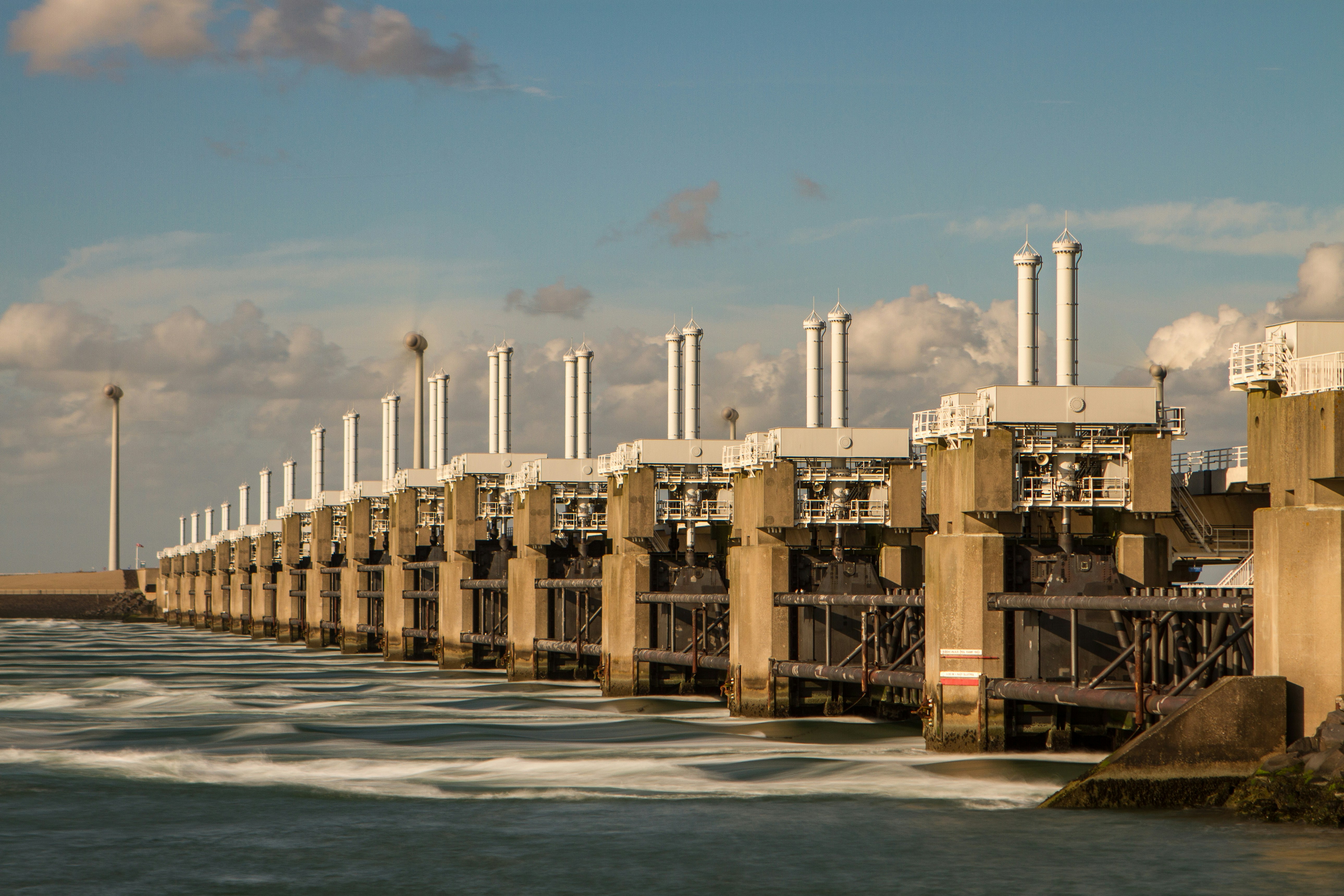 brown concrete building near body of water during daytime