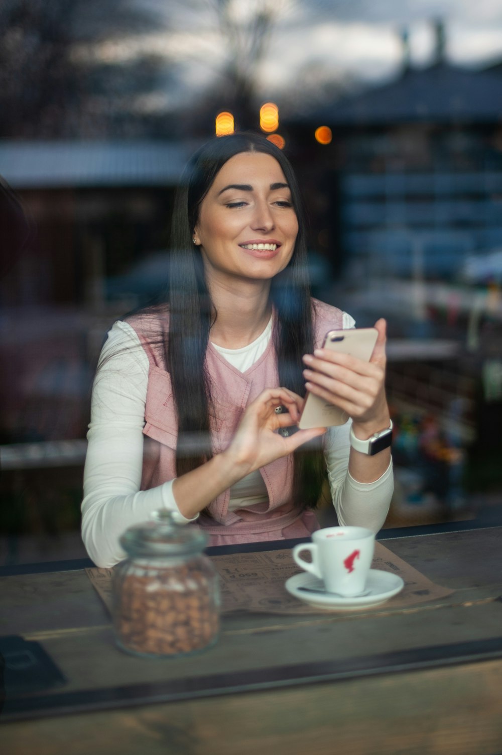 woman in white long sleeve shirt smiling