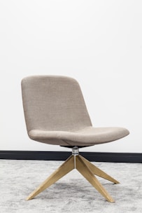 brown wooden framed gray padded chair