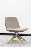 brown wooden framed gray padded chair