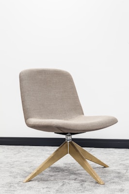 brown wooden framed gray padded chair