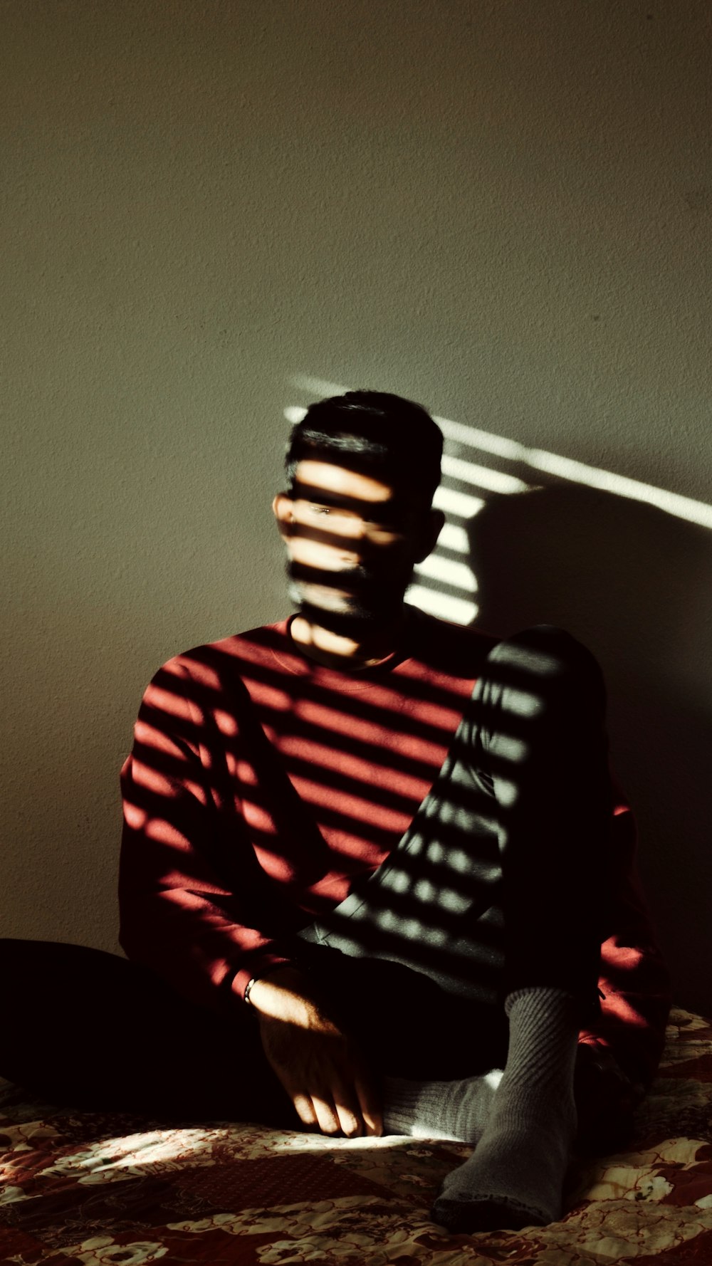 man in red and white striped shirt